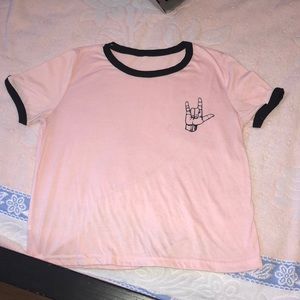 Pink t shirt with rock and roll sign